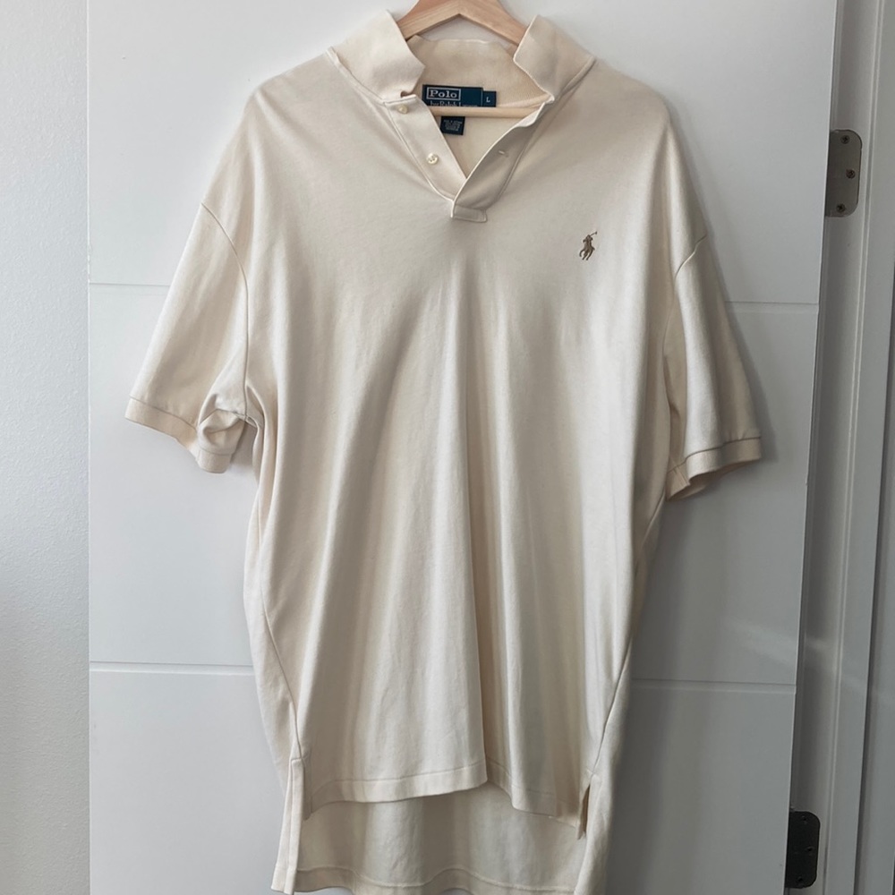 Polo shirt new never worn. The shirt is to long for me. Large has a small hole